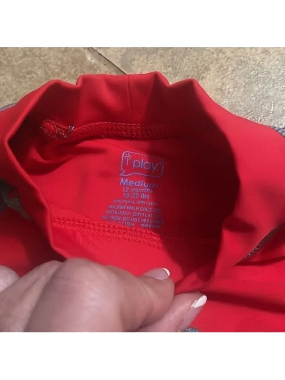 I play boys shark swim shirts and shirt size 12 months